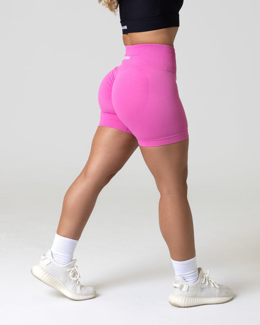 A woman wearing a high waisted workout shorts