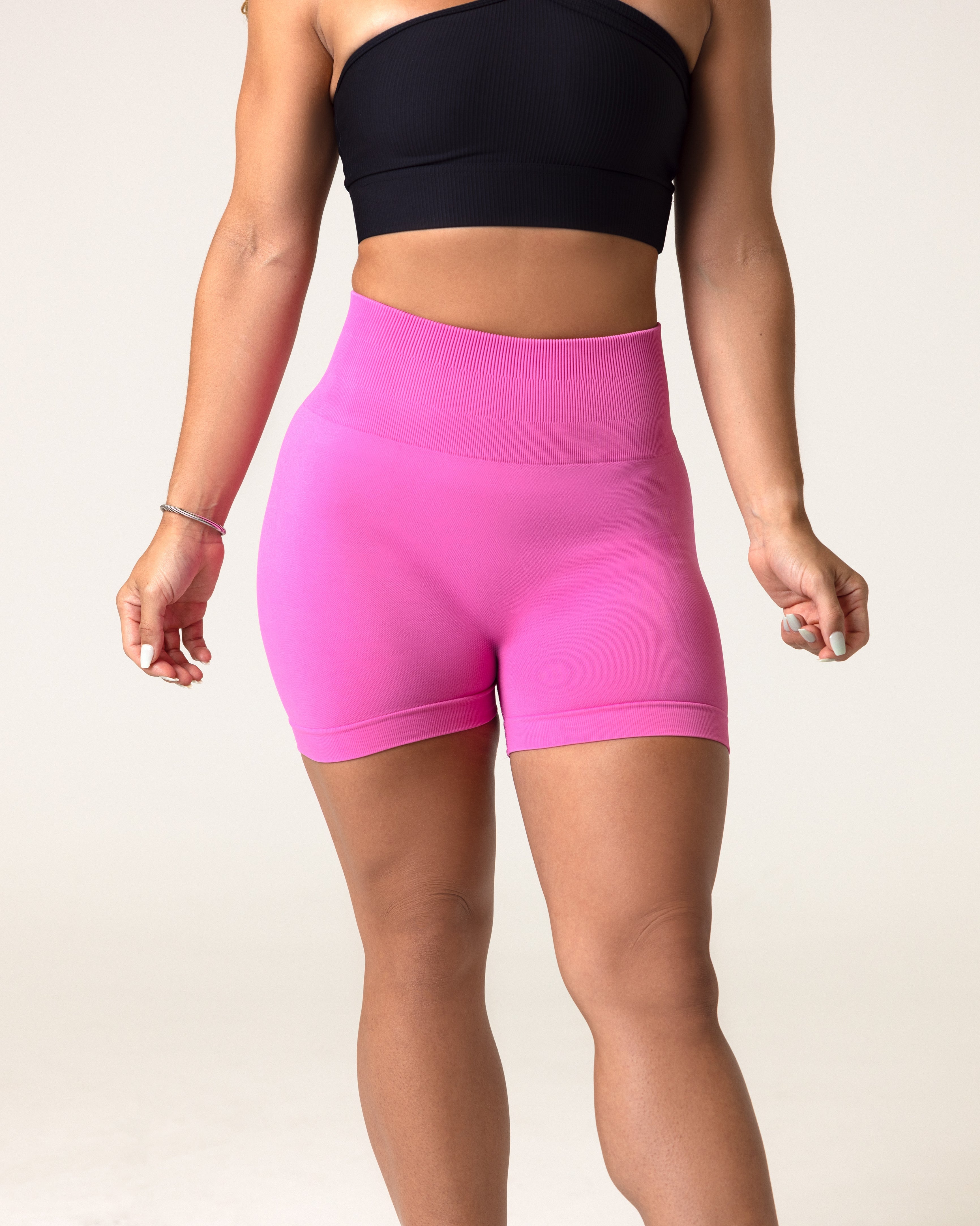 A woman wearing gym workout pink clothes