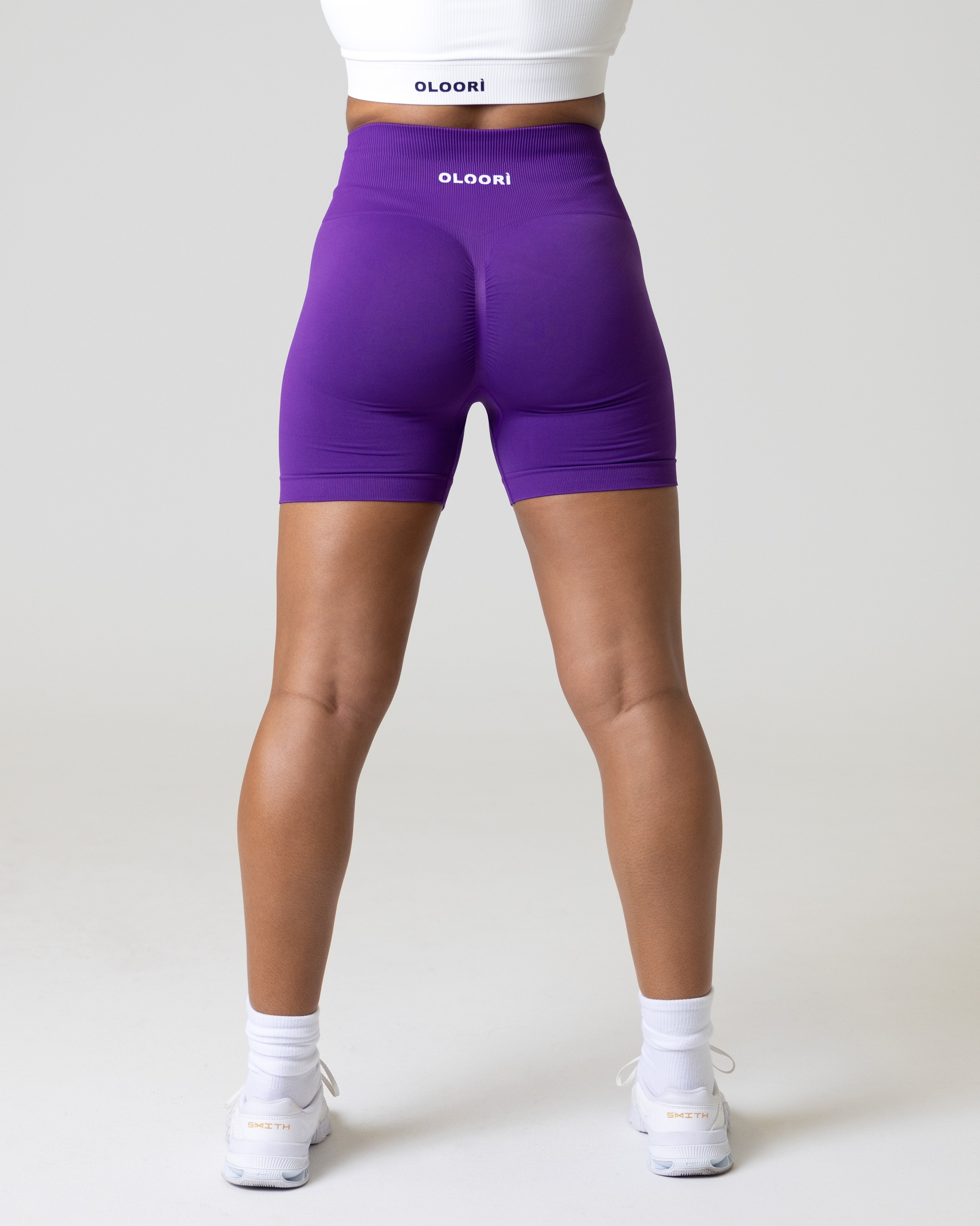 A woman wearing women's gym workout shorts