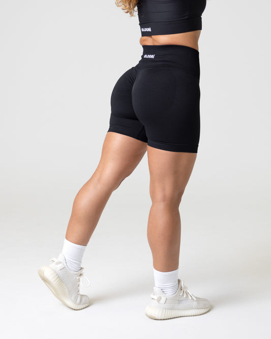 A woman wearing women's gym shorts